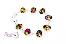 Load image into Gallery viewer, Pulsera ovalada con la virgen de Guadalupe adornado con flores